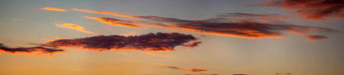 Fototapeta premium Beautiful colorful orange clouds at sunset