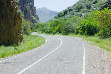 asphalt road between the mountains
