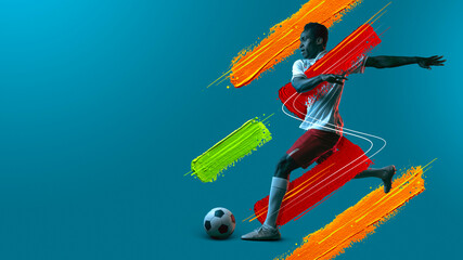 Young man, soccer footbal player training isolated in neon light background. © Lustre Art Group 