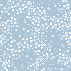 Ditsies floral pattern. Pretty flowers on light blue background. Printing with small white flowers. Ditsy print. Seamless vector texture. Spring bouquet.