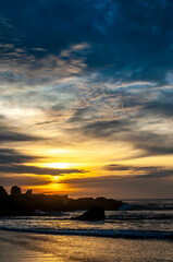 Fototapeta na wymiar sunset landscape at the sea with rocks