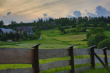 Green mountains landscape. Sunset over the hill. Mountains landscape panorama.