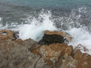 waves crashing on rocks