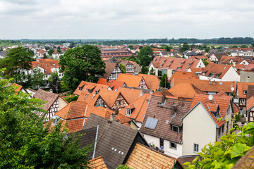 Fototapeta na wymiar Zwingenberg Cityscape with roofs of old town during a cloudy day