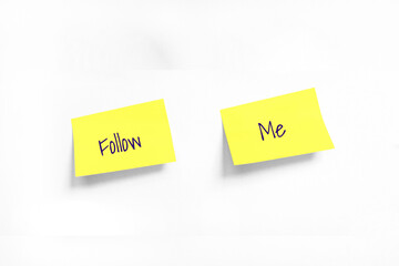 Follow Me Handwriting text on two Yellow stickers on white Whatman paper. Concept of learning, work, programming, testing, business. Handwriting text, copy space