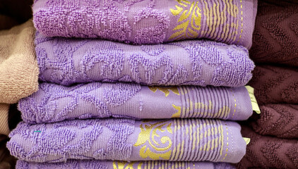 purple towels are on the counter in the supermarket