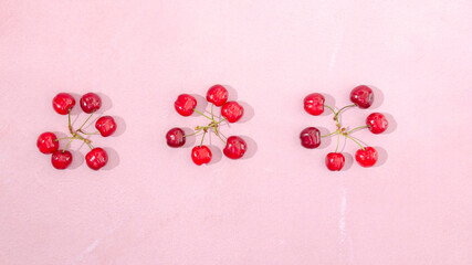 A banner made of vibrant red cherries. Joyful summer concept. Minimal creative design