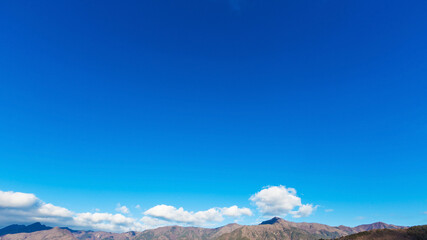 landscape river view of bridge, mountain and traffic under blue sky, nature background