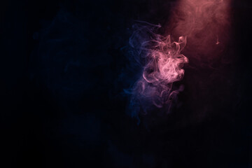 Blue and pink steam on a black background.