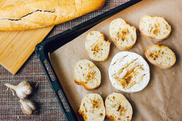 DIY baked cheese camembert instruction step by step. step 3 place the bread and camembert on a baking sheet with baking paper and add the spices. cheese with white mold.moldy cheese