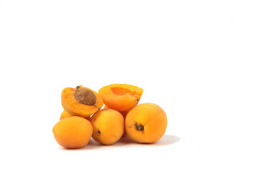 a pile of apricots isolated on white background