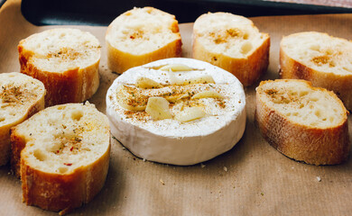 DIY baked cheese camembert instruction step by step. step 3 place the bread and camembert on a baking sheet with baking paper and add the spices. cheese with white mold.moldy cheese