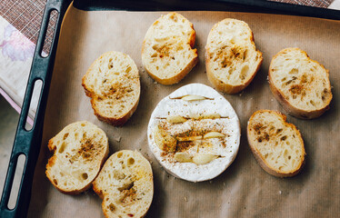 DIY baked cheese camembert instruction step by step. step 3 place the bread and camembert on a baking sheet with baking paper and add the spices. cheese with white mold.moldy cheese