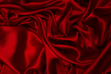 Rich and luxury red silk fabric texture background.