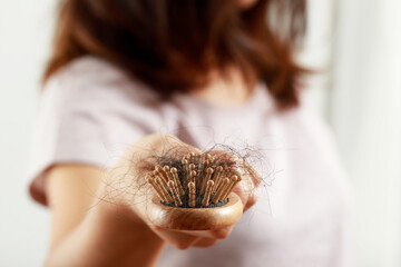 A woman has a problem with hair loss.