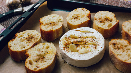 DIY baked cheese camembert instruction step by step. step 3 place the bread and camembert on a baking sheet with baking paper and add the spices. cheese with white mold.moldy cheese