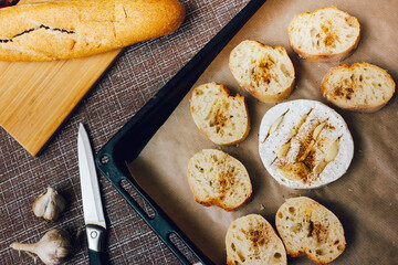 DIY baked cheese camembert instruction step by step. step 3 place the bread and camembert on a baking sheet with baking paper and add the spices. cheese with white mold.moldy cheese