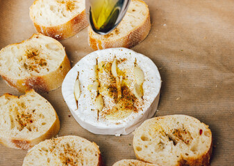 DIY baked cheese camembert instruction step by step. step 4 add olive oil. cheese with white mold.moldy cheese.
