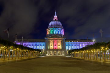Summer blue foggy skies over San Francisco City Hall lit up in rainbow colors for the 2021 Pride - obrazy, fototapety, plakaty