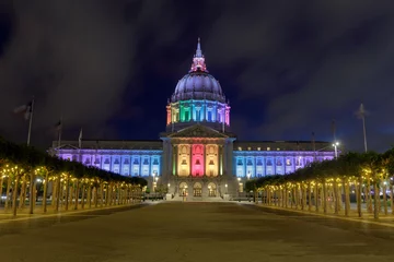 Poster Summer blue foggy skies over San Francisco City Hall lit up in rainbow colors for the 2021 Pride © Yuval Helfman