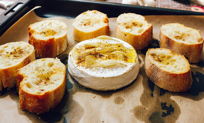 homemade DIY baked camembert with garlic.cheese with white mold.baked cheese.