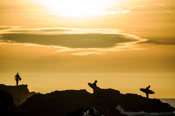 Fototapeta na wymiar surfer cilhouette at sunset
