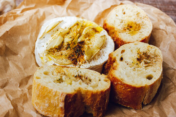 homemade DIY baked camembert with garlic.cheese with white mold.baked cheese.
