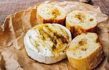 homemade DIY baked camembert with garlic.cheese with white mold.baked cheese.