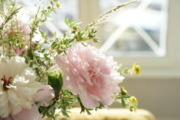 Bouquet of pink peonies in the interior