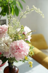 Bouquet of pink peonies in the interior