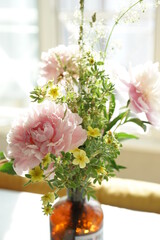 Bouquet of pink peonies in the interior