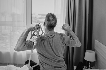 monochrome portrait of Happy rested man with chronic breathing issues after using  CPAP machine...