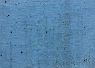Old paint on blue dirty wall surface