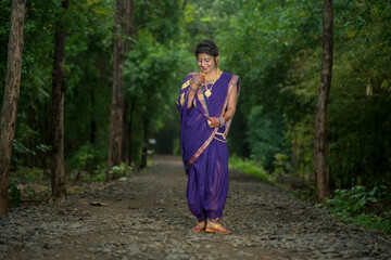 Indian Traditional Beautiful young girl in saree posing outdoors