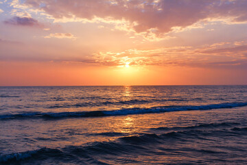 Sunset at the beach in Antalya Turkey with a dramatic purple sky, mediterranean sea.