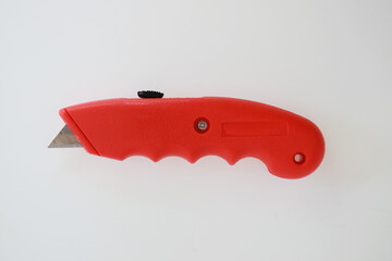 Red cutter knife handle for house tool fix and working with packaging or open package