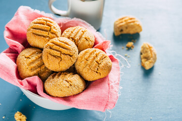 cookies in a bowl on a blue background. homemade baking. copy space