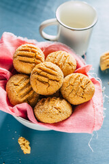 cookies in a bowl on a blue background. homemade baking. copy space