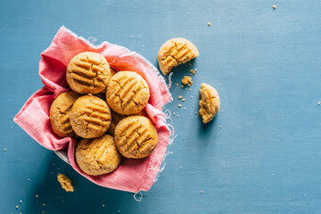 Homemade peanut cookies on a blue background