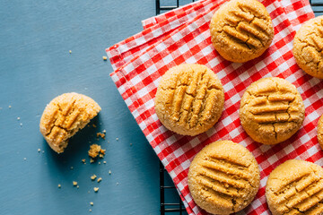 Homemade peanut cookies on a blue background
