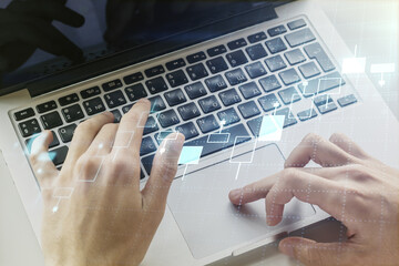 Double exposure of abstract creative financial chart with hand typing on computer keyboard on background, research and strategy concept