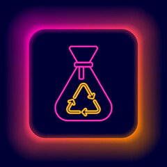 Glowing neon line Garbage bag with recycle symbol icon isolated on black background. Trash can icon. Recycle basket sign. Colorful outline concept. Vector