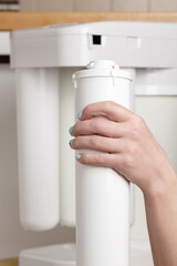 replacing the cartridge in the water filter