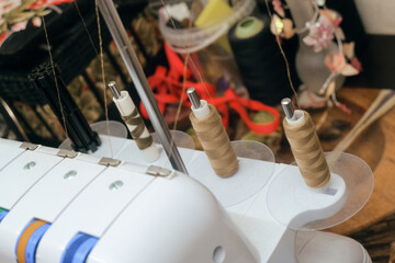 Four-thread overlock. Rear view of the four spools. Limited depth of field.