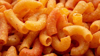 Close up of a pile of macaroni. Background of Pile of pasta