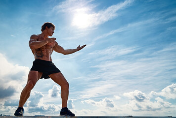 A muay thai or kickboxer training with shadow boxing outdoor