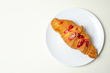 Croissants with strawberries and chocolate. High quality photo