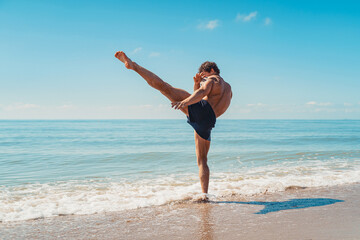 A muay thai or kickboxer training with shadow boxing outdoor at seashore