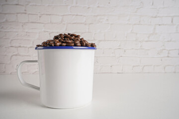 coffee beans in white glass white brick background scene