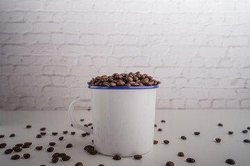 coffee beans in white glass white brick background scene